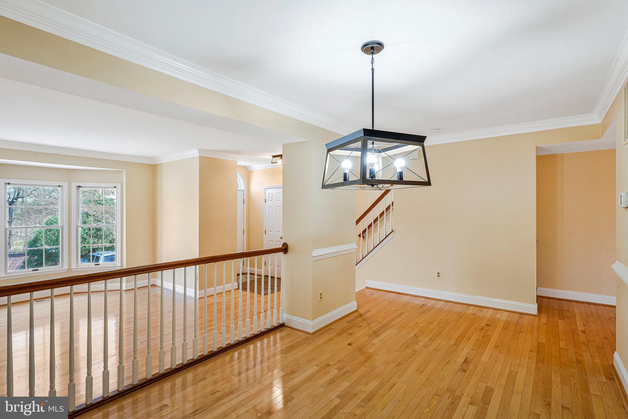 6556 Antrican Drive Springfield, VA 22150 - Photo 7 of 36 a view of an empty room with wooden floor and a window