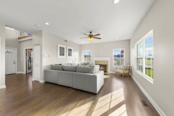 a living room with furniture and a fireplace