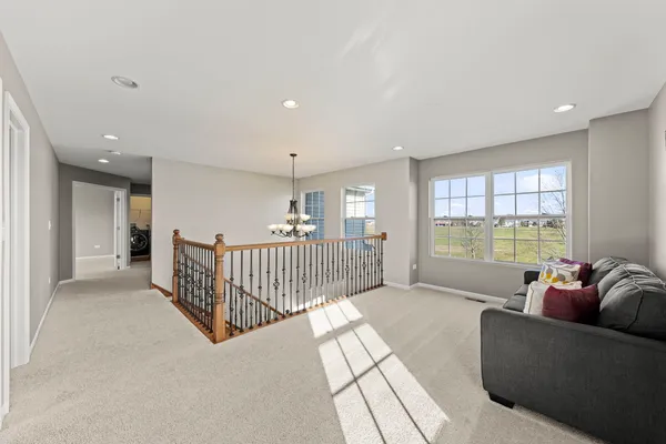 a living room with furniture and windows