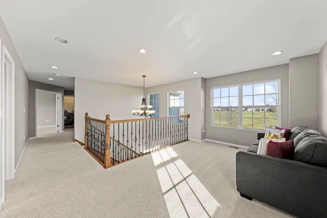 a living room with furniture and windows