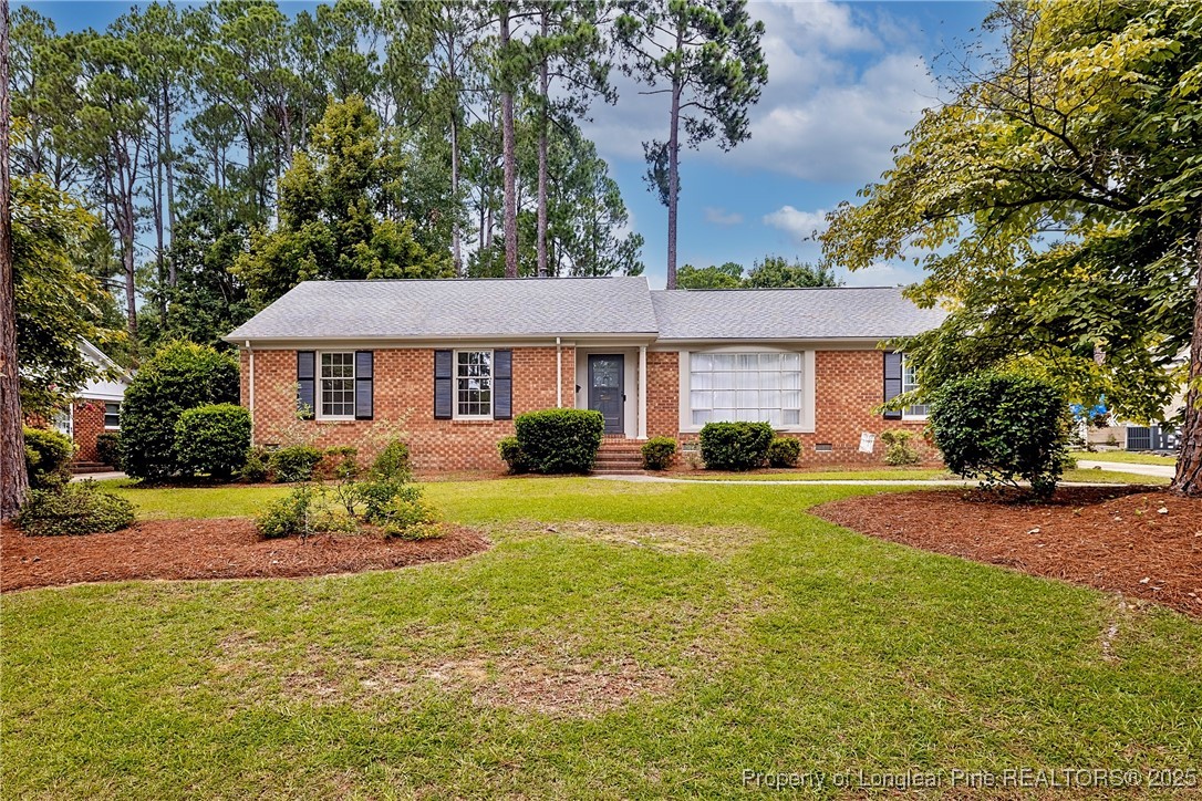 2818 Millbrook Road Fayetteville, NC 28303 - Photo 1 of 32 a front view of a house with a yard