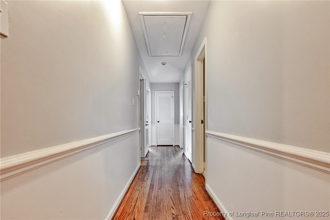 2818 Millbrook Road Fayetteville, NC 28303 - Photo 18 of 32 a view of hallway with wooden floor