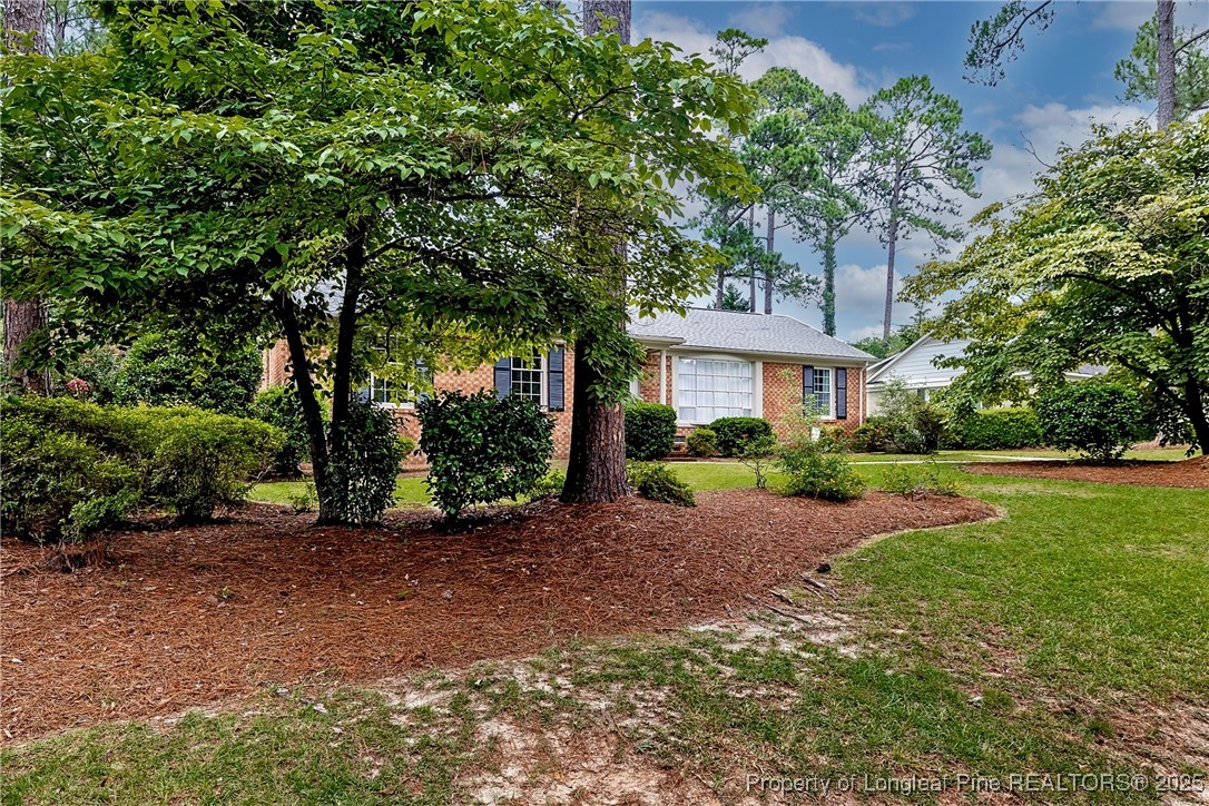 2818 Millbrook Road Fayetteville, NC 28303 - Photo 2 of 32 a view of a house with a yard