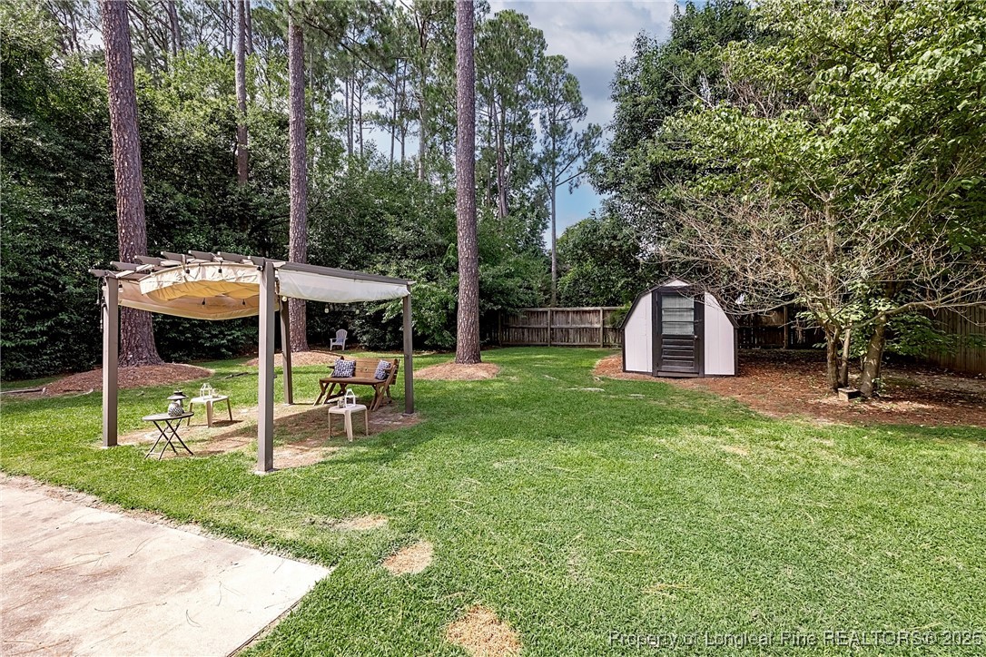 2818 Millbrook Road Fayetteville, NC 28303 - Photo 29 of 32 a view of a house with backyard and sitting area