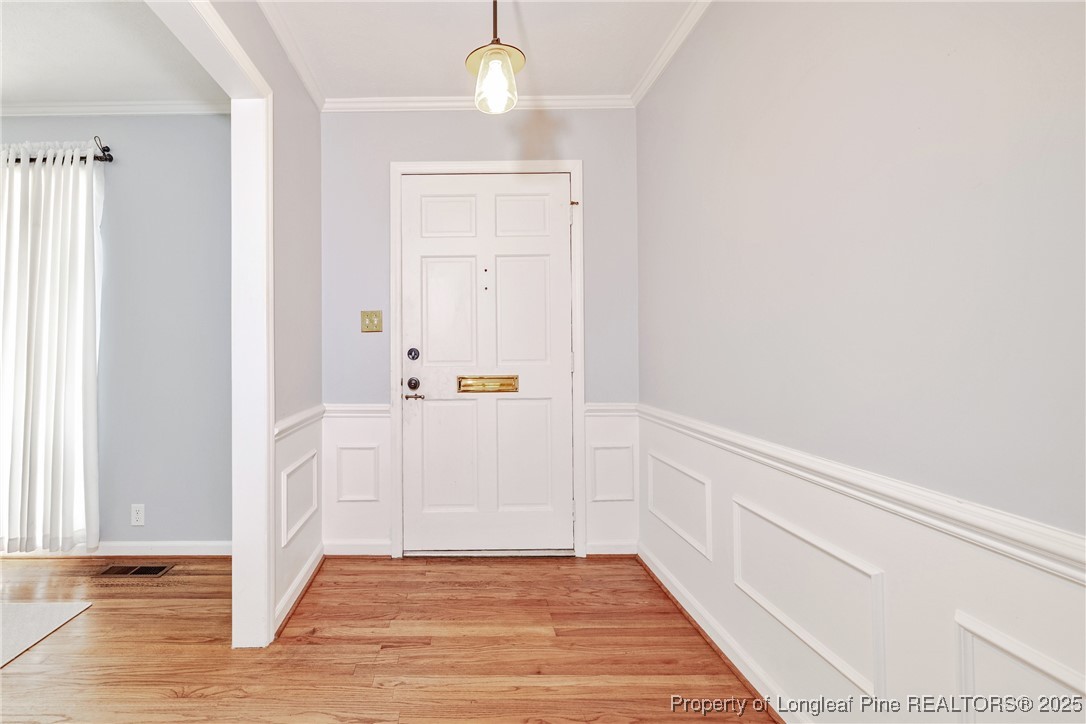 2818 Millbrook Road Fayetteville, NC 28303 - Photo 5 of 32 a view of hallway with wooden floor