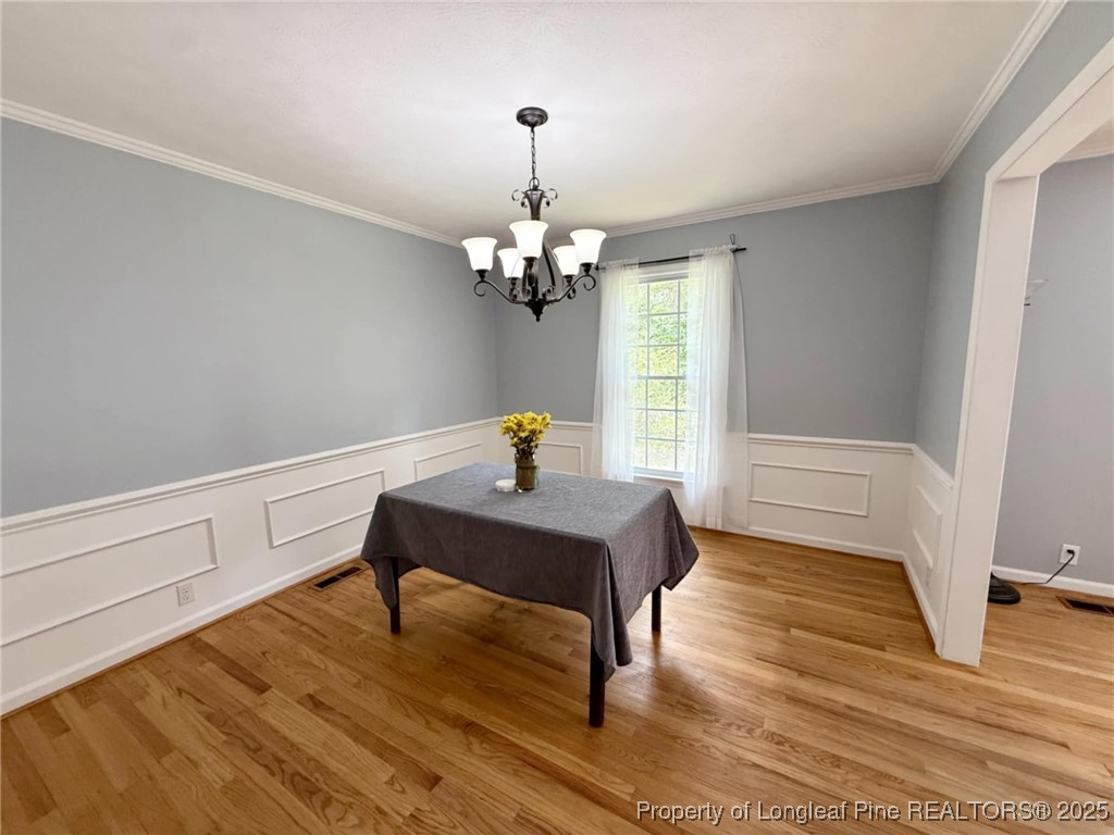 2818 Millbrook Road Fayetteville, NC 28303 - Photo 9 of 32 a view of a workspace and wooden floor