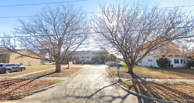 a view of a playground with a yard
