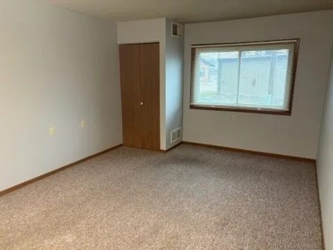 a kitchen with sink and cabinets