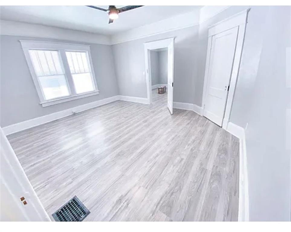 1127 Metropolitan Parkway Southwest Atlanta, GA 30310 - Photo 14 of 23 wooden floor in an empty room with a window