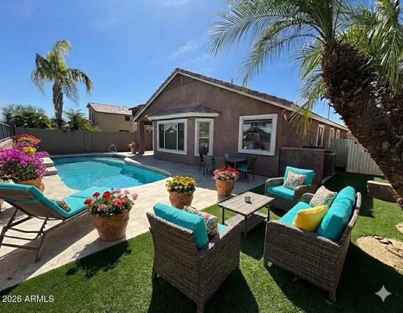 a view of a patio with couches chairs and a fire pit