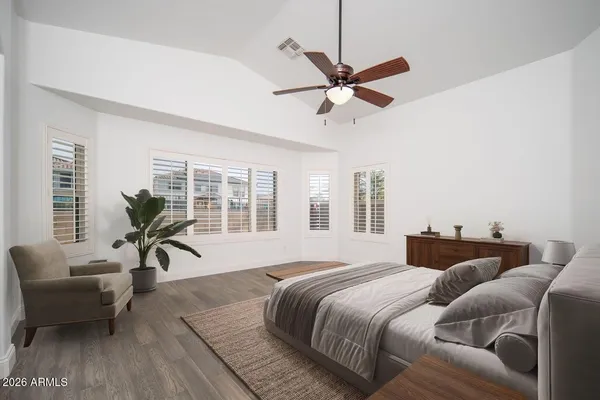 a view of a house with swimming pool and sitting area