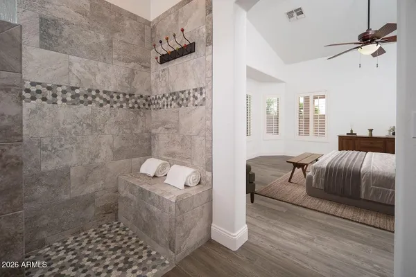a view of a patio with couches and a table and chairs with garden view