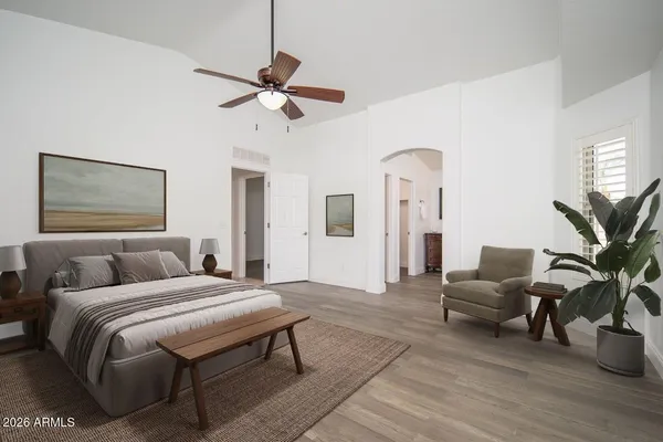 a view of a backyard with furniture and a garden
