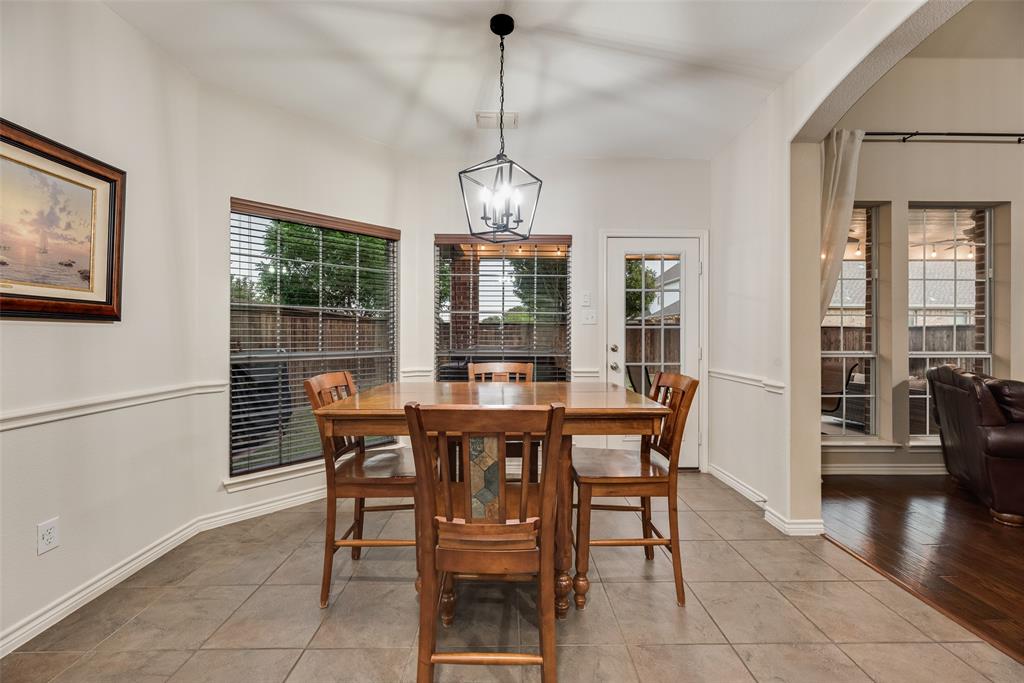 11920 Vienna Apple Road Fort Worth, TX 76244 - Photo 16 of 40 Breakfast area in kitchen with fresh paint, ceramic tile floors and views of the backyard patio at 11920 Vienna Apple in Villages of Woodland Springs community in North Fort Worth