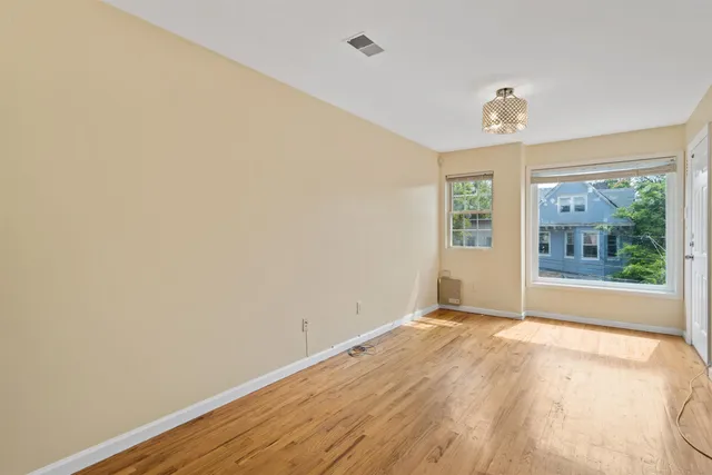 a view of an empty room with a window