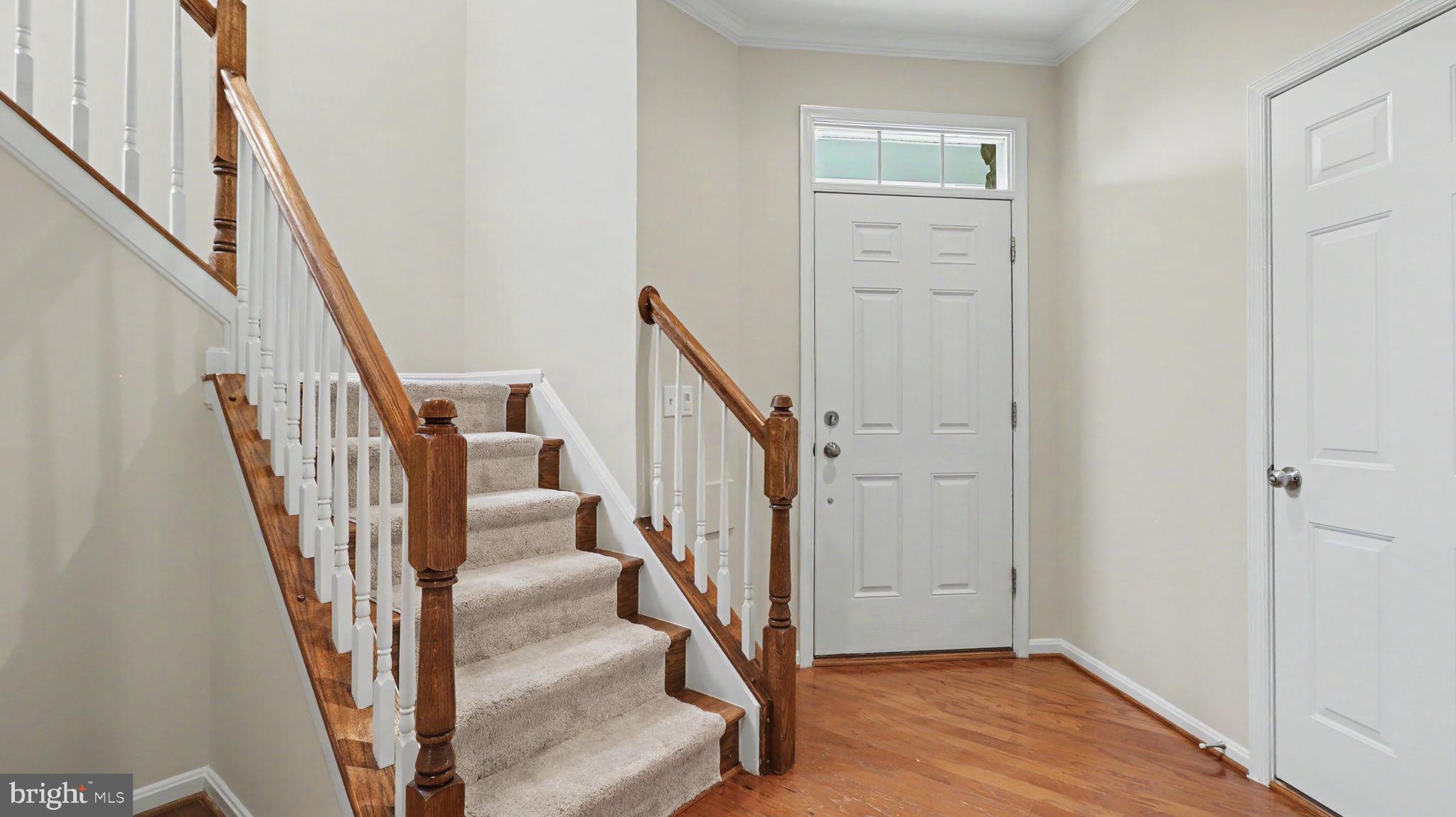 42371 Trellis Square Brambleton, VA 20148 - Photo 13 of 70 Welcoming entry with elegant staircase.