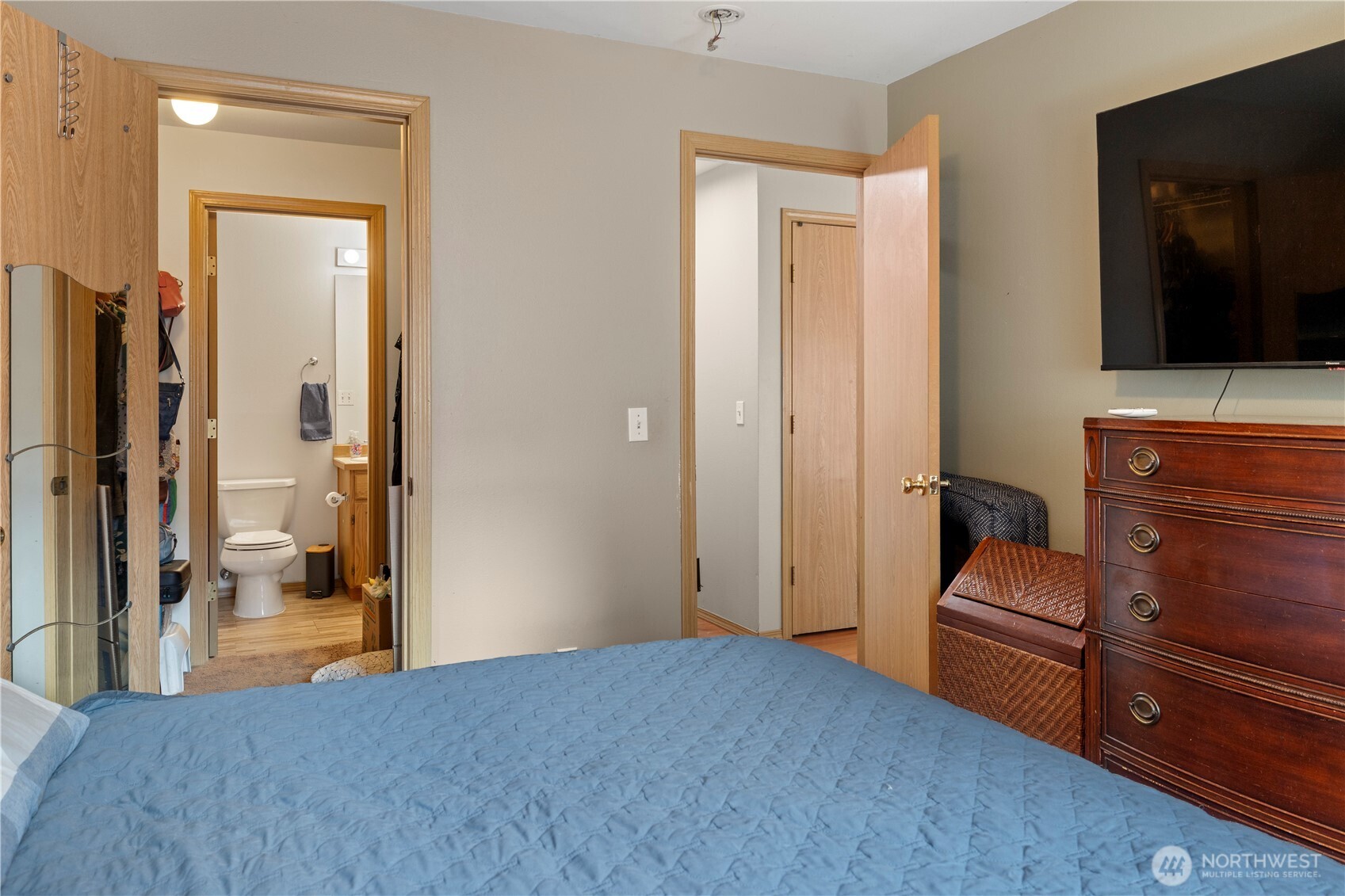 6352 24th Avenue Southwest Seattle, WA 98106 - Photo 11 of 31 a bedroom with a bed and wooden floor
