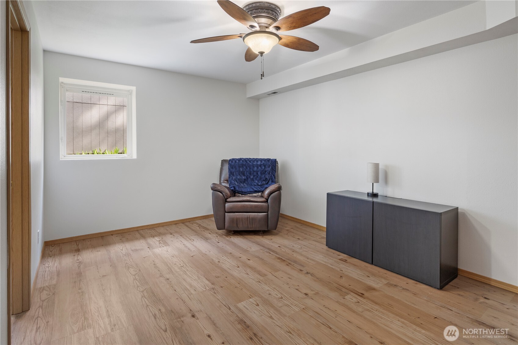 6352 24th Avenue Southwest Seattle, WA 98106 - Photo 17 of 31 a living room with furniture and a window