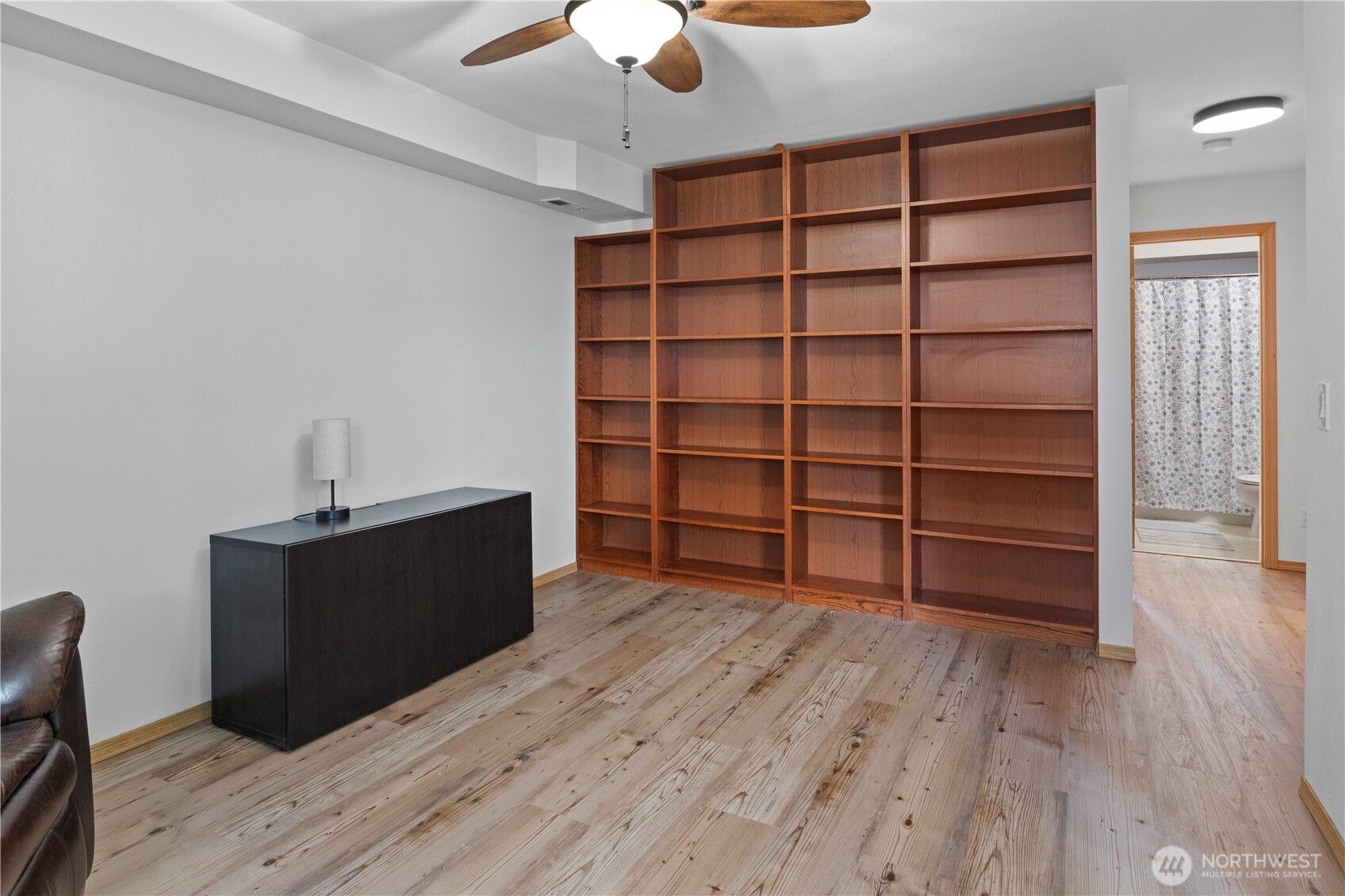 6352 24th Avenue Southwest Seattle, WA 98106 - Photo 18 of 31 a room with wooden floor and closet