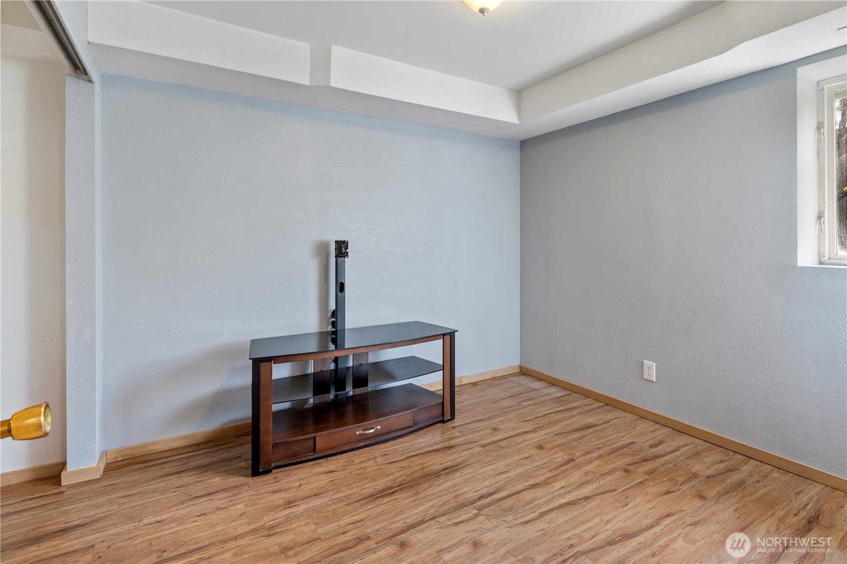 6352 24th Avenue Southwest Seattle, WA 98106 - Photo 21 of 31 a view of a room with wooden floor and fan