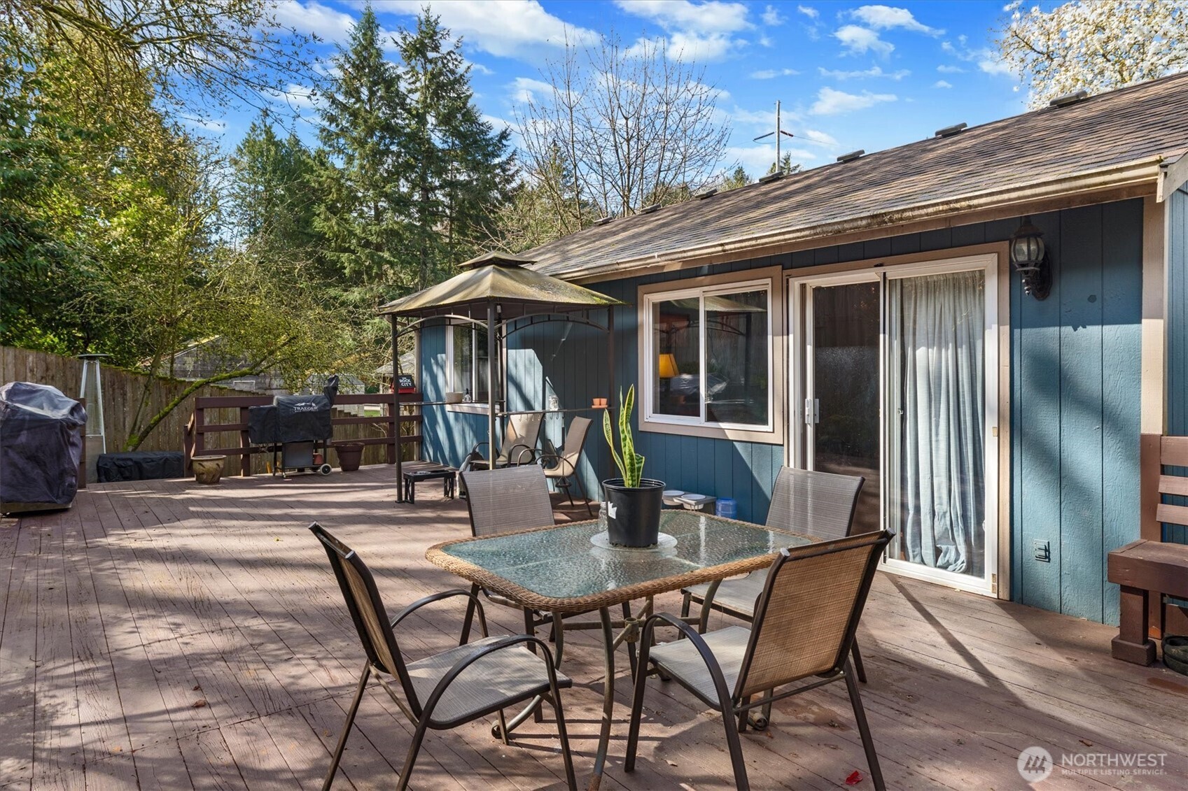6352 24th Avenue Southwest Seattle, WA 98106 - Photo 24 of 31 a view of a patio with table and chairs and potted plants
