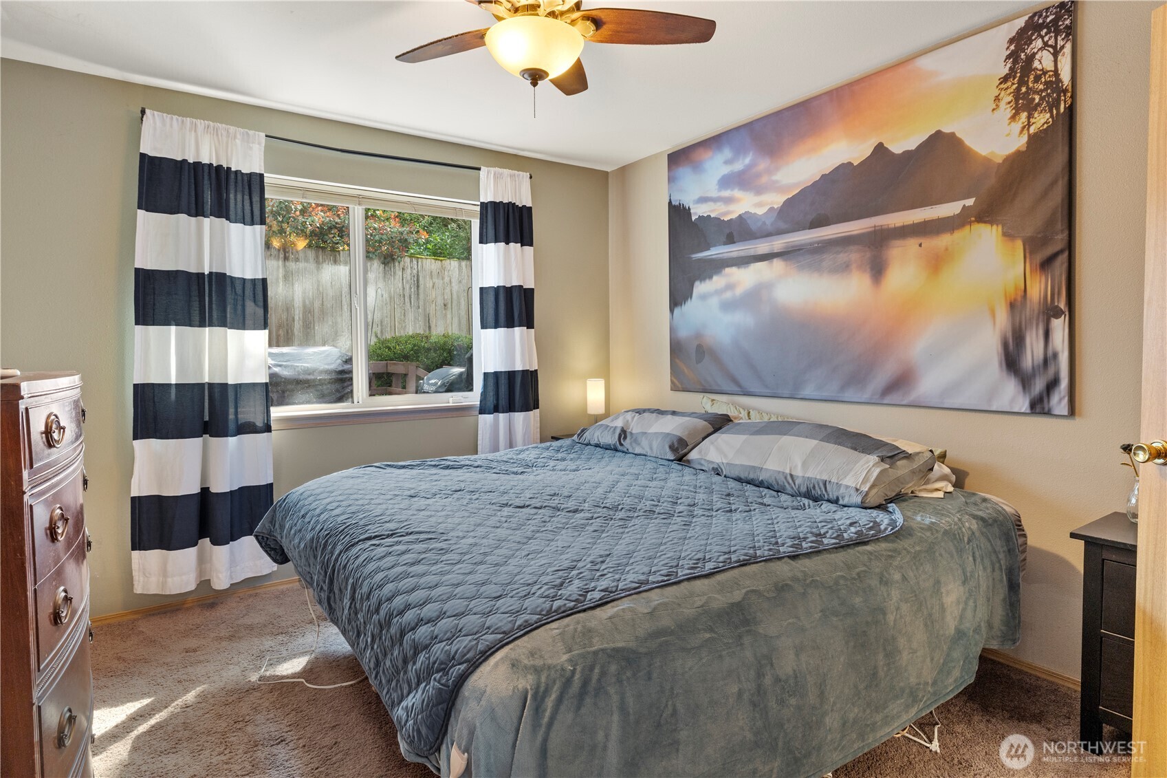 6352 24th Avenue Southwest Seattle, WA 98106 - Photo 10 of 31 a bedroom with a bed and a painting on the wall