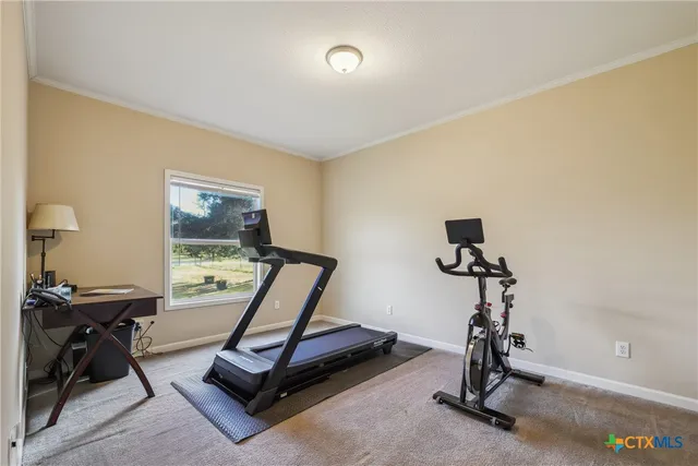 a bathroom with a granite countertop sink a mirror and a shower