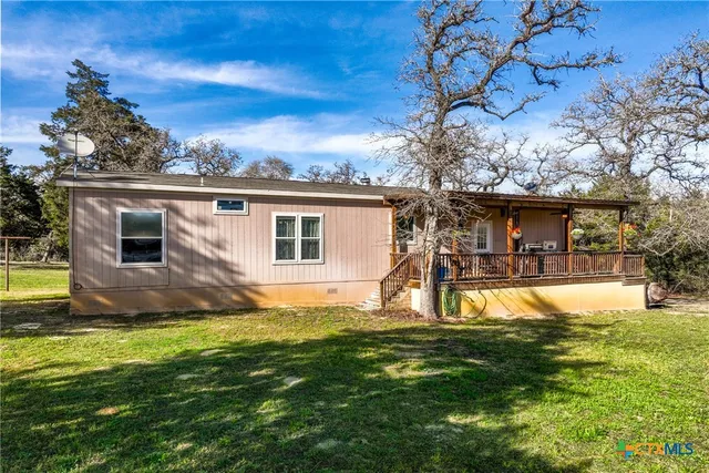 a view of a swimming pool with an outdoor space and seating area