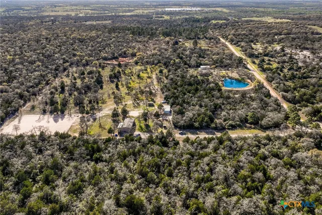 an aerial view of residential houses with outdoor space