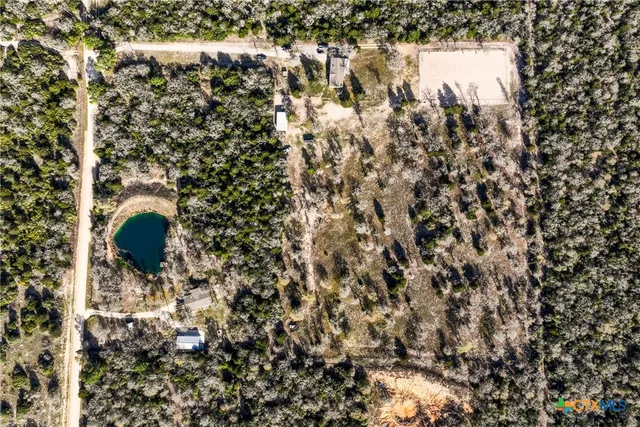 an aerial view of residential houses with outdoor space