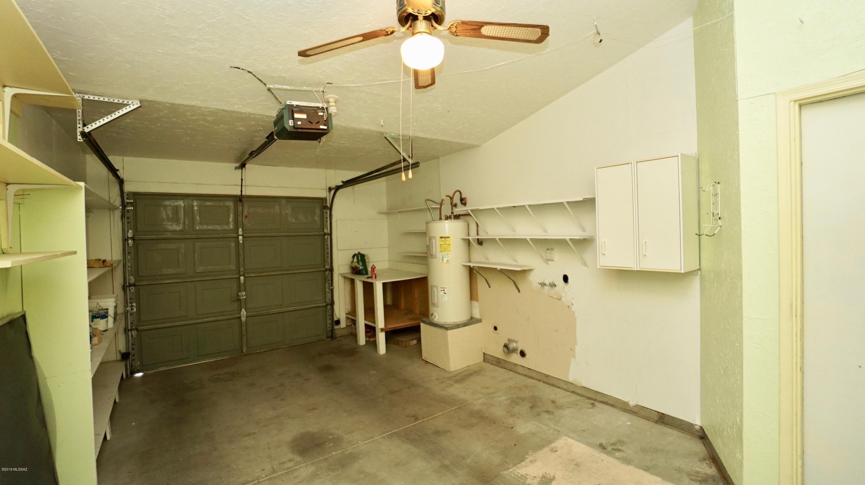 4796 South Lincoln Ridge Drive Tucson, AZ 85730 - Photo 12 of 12 a view of a room with racks on the wall