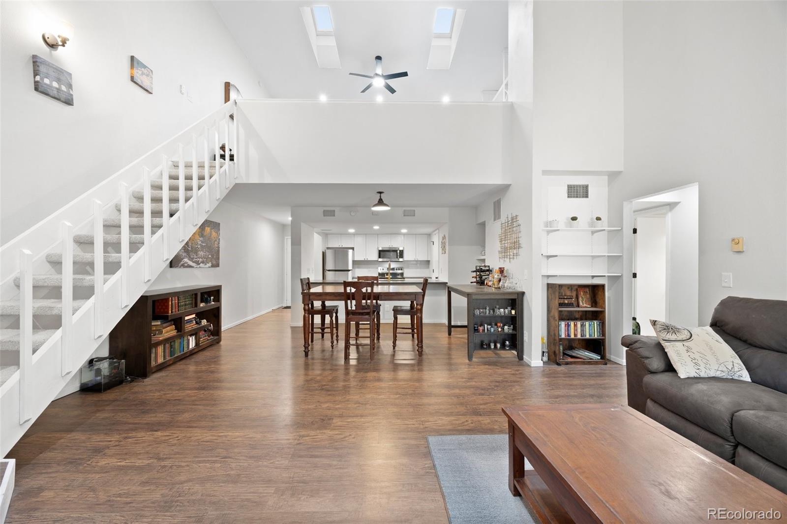 23551 Genesee Village Road, Unit H Golden, CO 80401 - Photo 1 of 40 a living room with furniture and a fireplace
