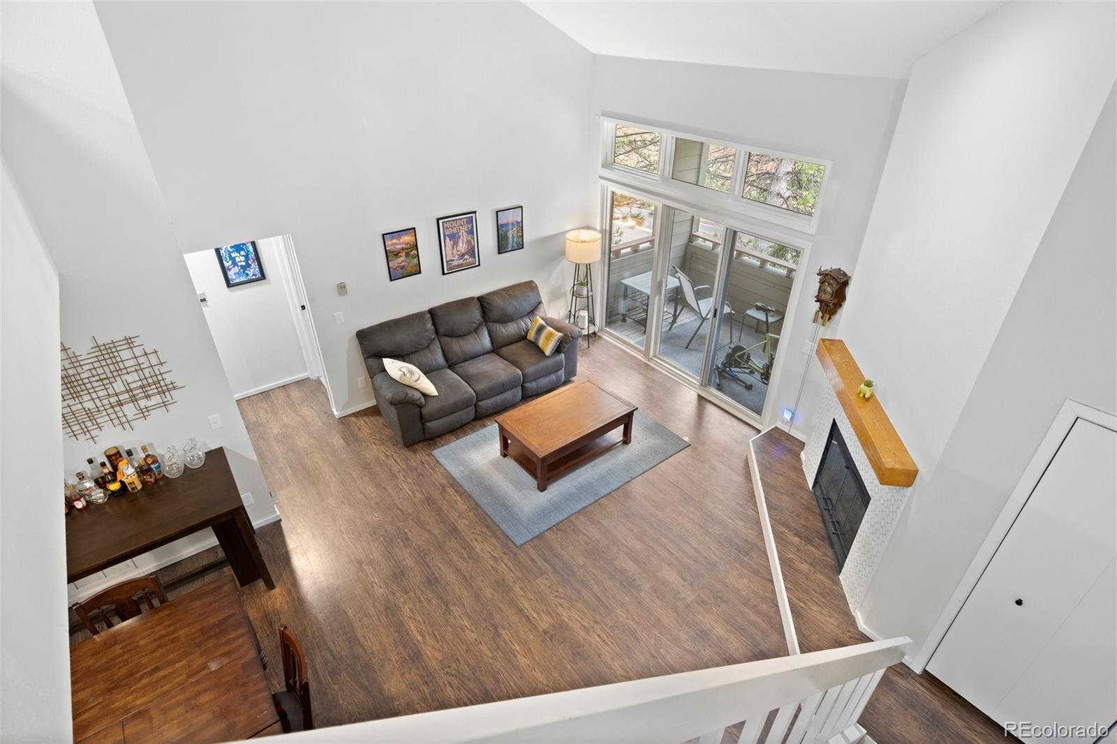23551 Genesee Village Road, Unit H Golden, CO 80401 - Photo 3 of 40 a living room with furniture and a flat screen tv