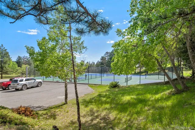 a view of street with parked cars