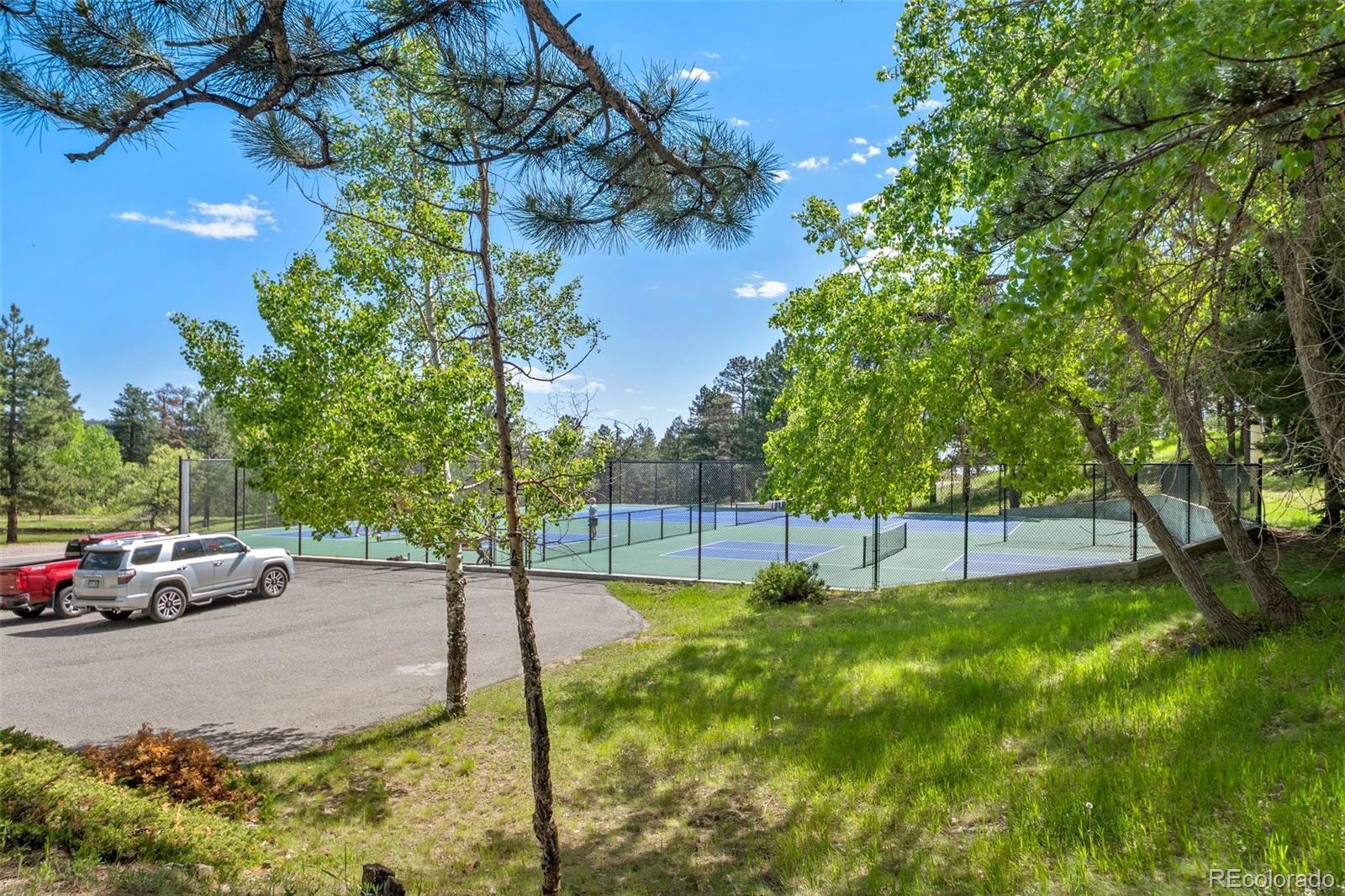 23551 Genesee Village Road, Unit H Golden, CO 80401 - Photo 33 of 40 a view of street with parked cars