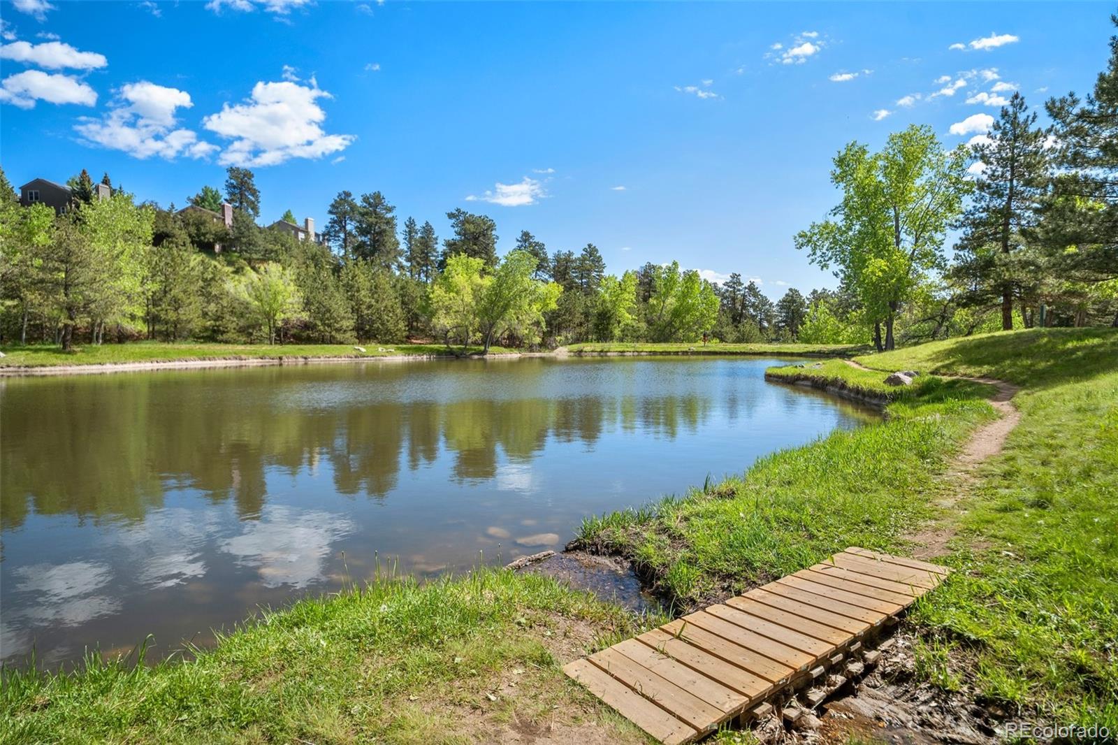 23551 Genesee Village Road, Unit H Golden, CO 80401 - Photo 35 of 40 a view of a lake with outdoor space