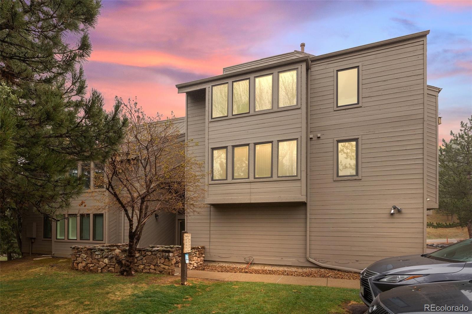23551 Genesee Village Road, Unit H Golden, CO 80401 - Photo 4 of 40 a front view of a house with a yard