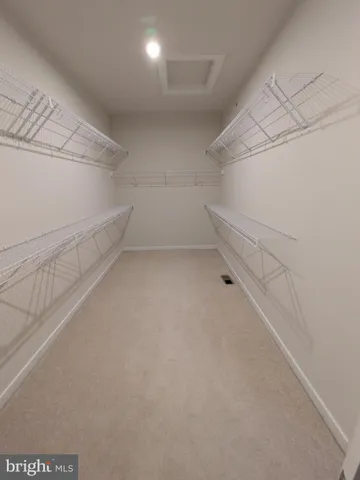 a view of a room with racks on the wall