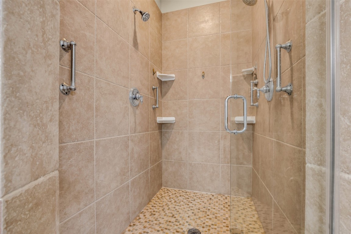 209 East George Jones Road Livingston, TX 77351 - Photo 12 of 26 This oversized custom shower deserved a showcase; featuring multiple shower heads and with independent temperature control.