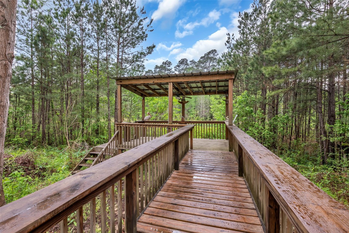 209 East George Jones Road Livingston, TX 77351 - Photo 23 of 26 Immerse yourself in nature when you walk onto this private pier. The pier was rebuilt in 2025 and will stand strong for years to come.