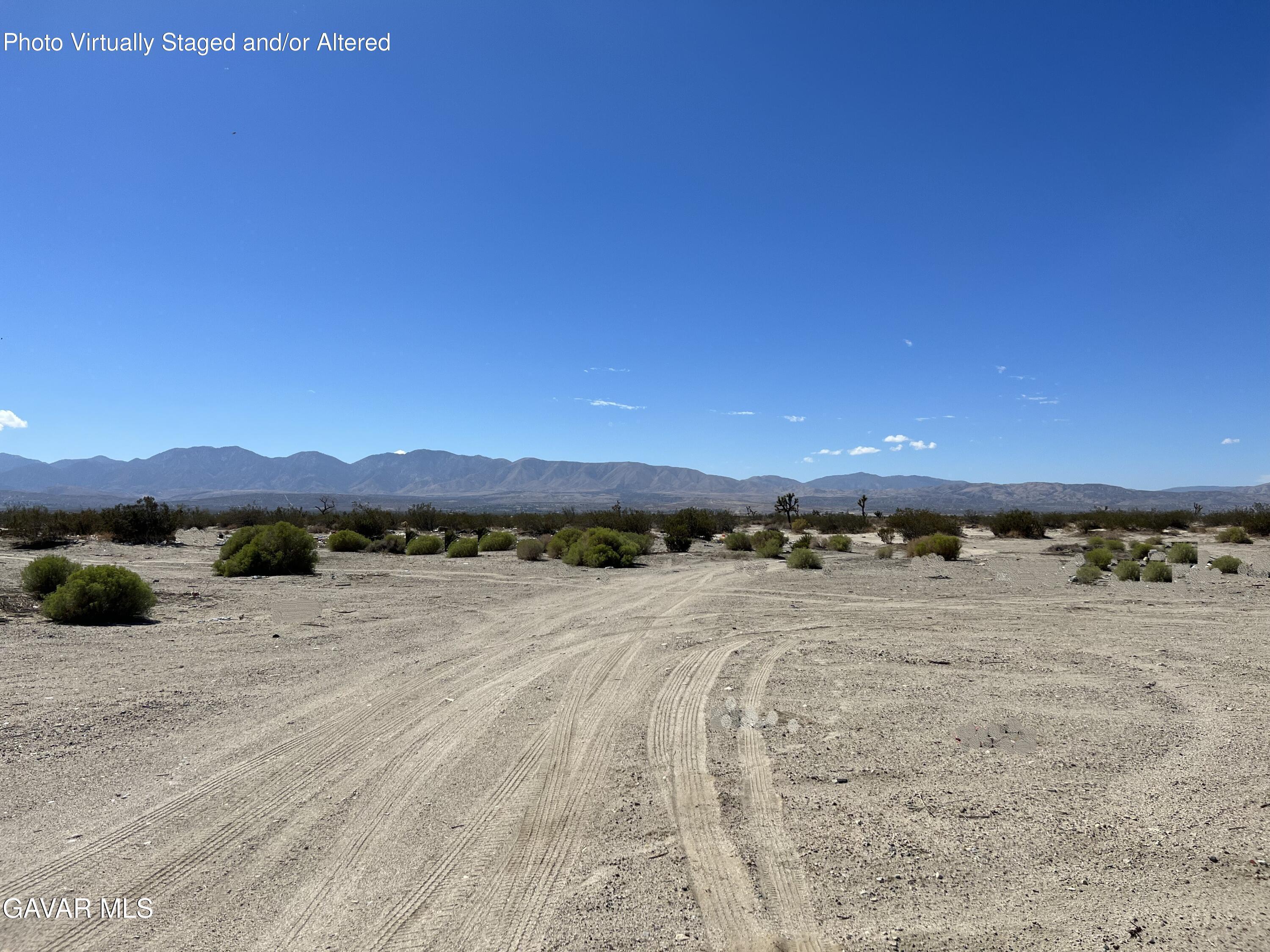 Ave R Vic 147th Sun Village Palmdale, CA 93591 - Photo 2 of 3 a view of an ocean beach and mountain