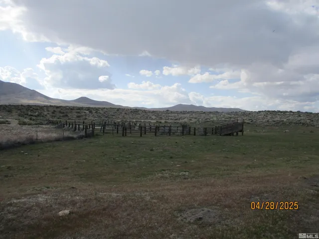 a view of a lake with houses in back