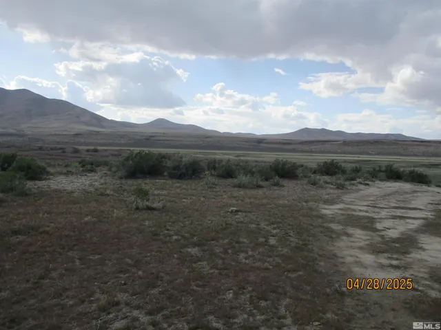 a view of an outdoor space and mountains