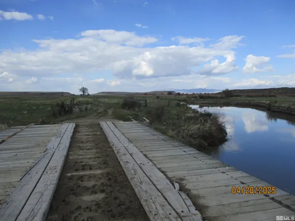 a view of a lake with a yard