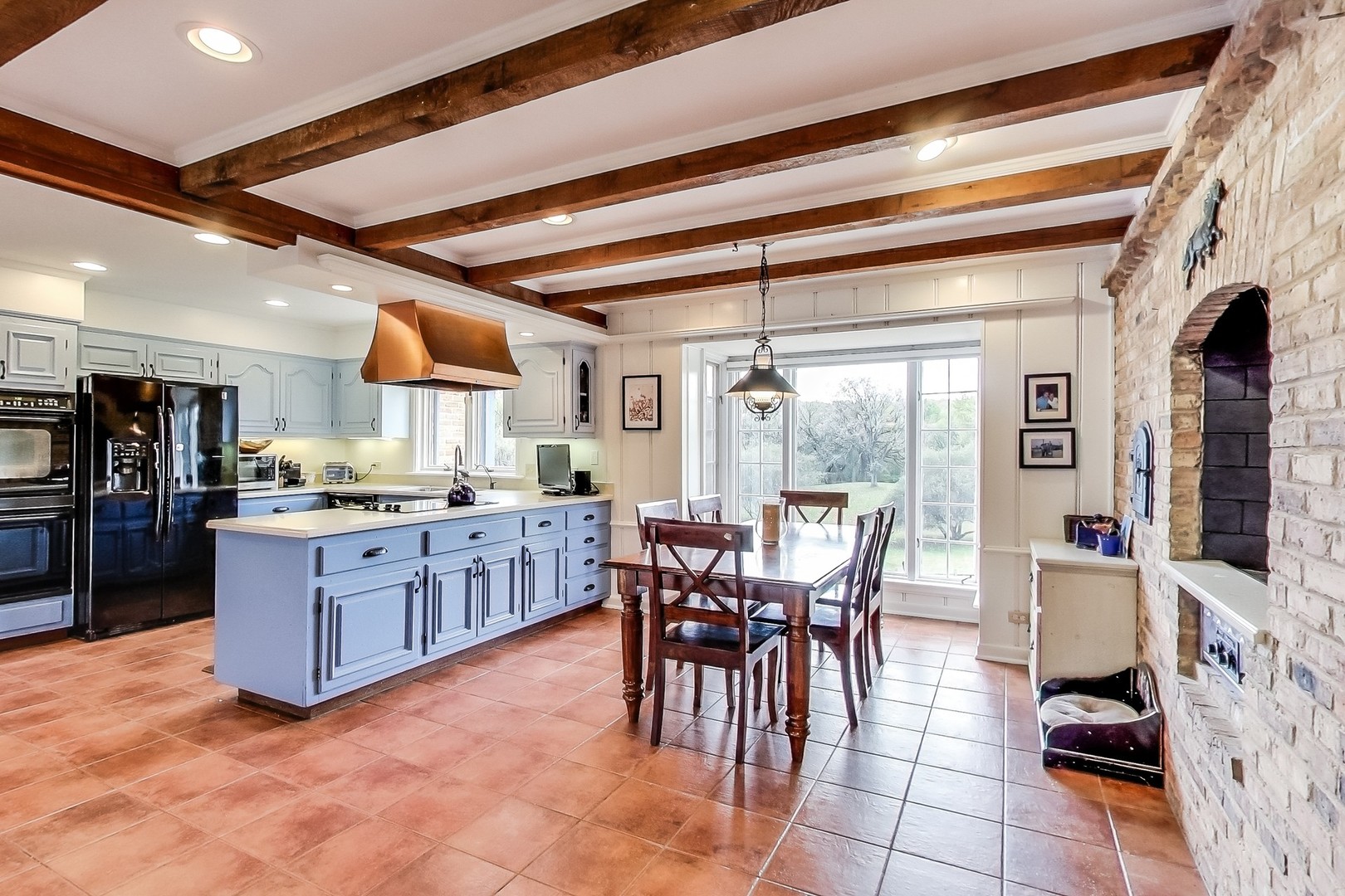 2 Far Hills Road Barrington Hills, IL 60010 - Photo 20 of 37 a kitchen with stainless steel appliances kitchen island granite countertop a table chairs and a refrigerator