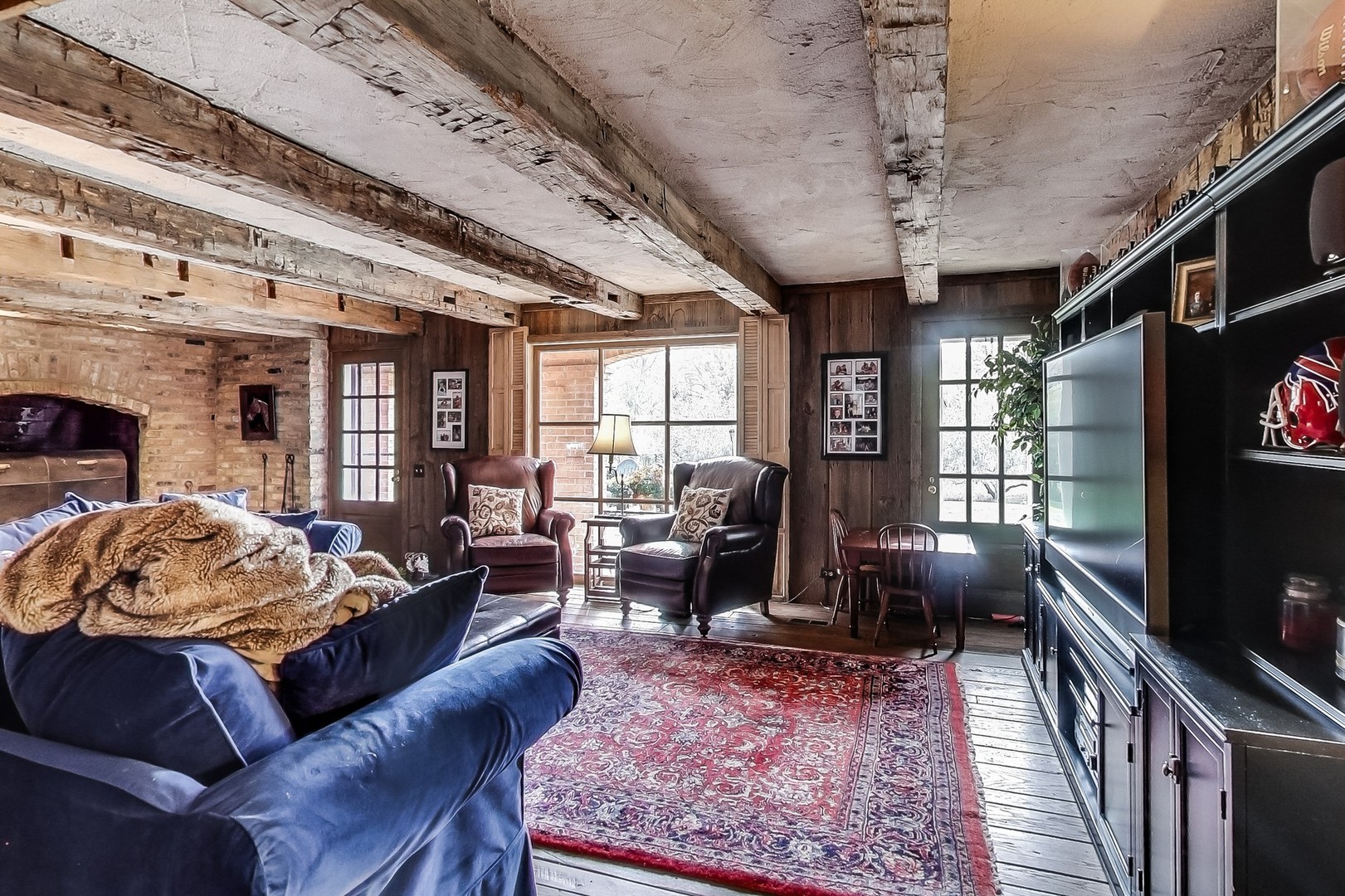 2 Far Hills Road Barrington Hills, IL 60010 - Photo 28 of 37 a living room with furniture a chandelier and a flat screen tv