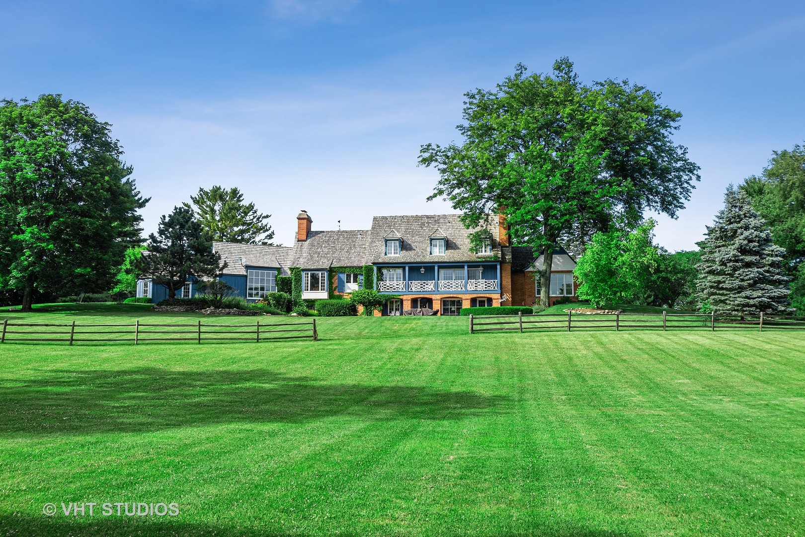 2 Far Hills Road Barrington Hills, IL 60010 - Photo 8 of 37 a view of a big house with a big yard and large trees