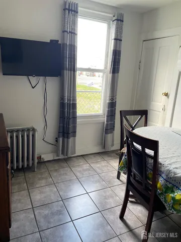 a living room with a furniture and a window