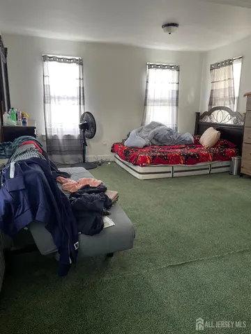 a bed room with a bed and a window