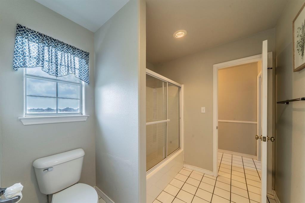 1992 Bledsoe Road Gunter, TX 75058 - Photo 20 of 40 a bathroom with a toilet and a shower